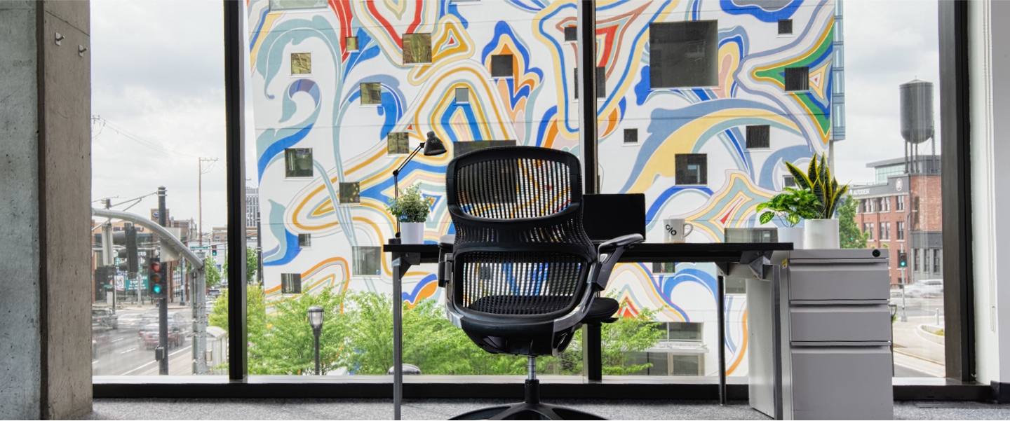 A window desk facing the mural at CENTRL Eastside.