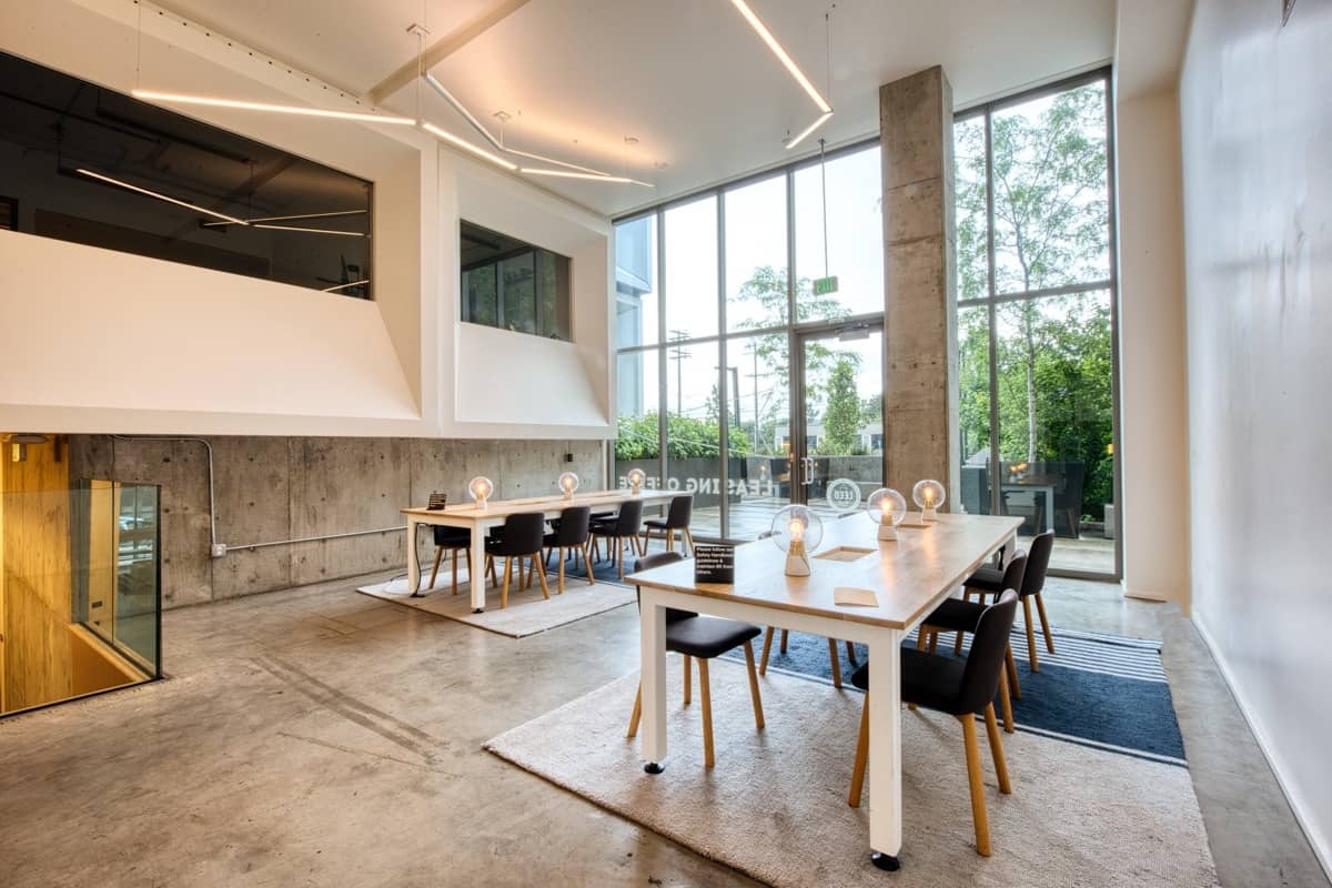 Shared tables by the windows at CENTRL Eastside.