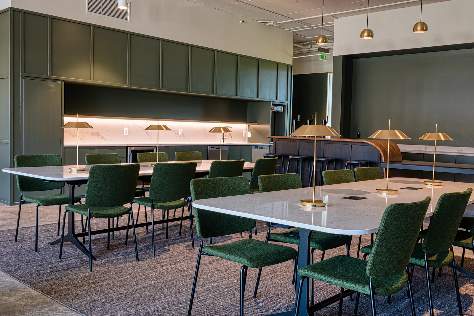 Shared tables by the kitchen at CENTRL Lake Oswego.