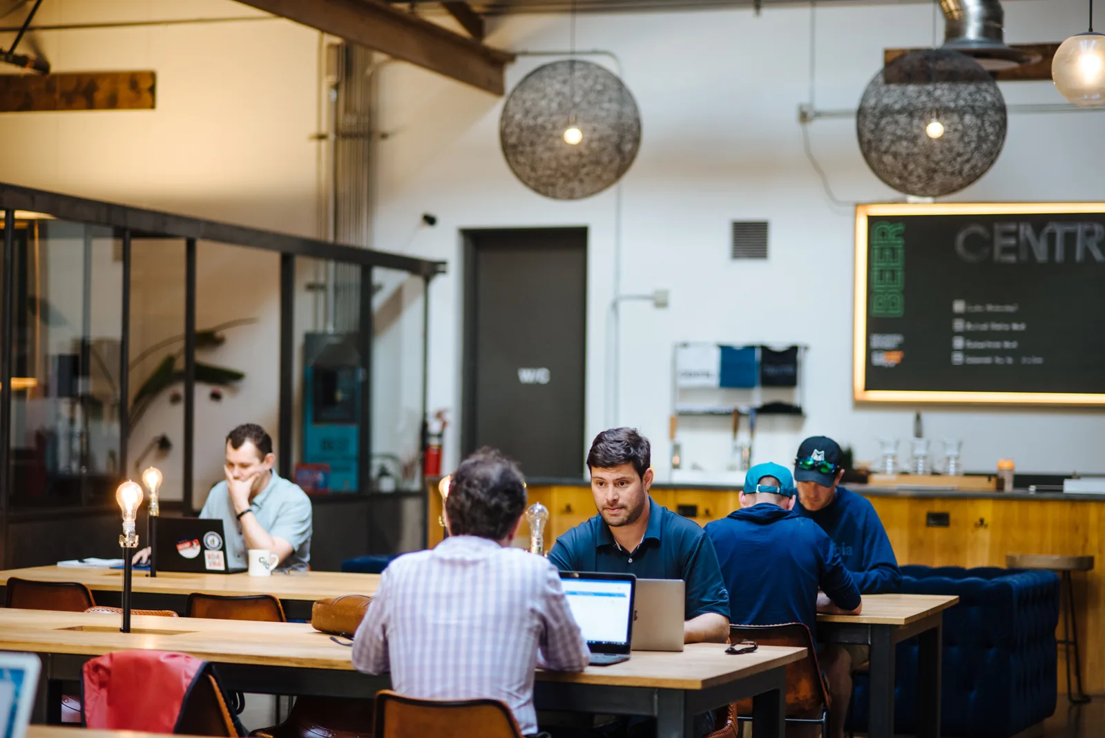 Members at the shared tables at CENTRL Pearl District.