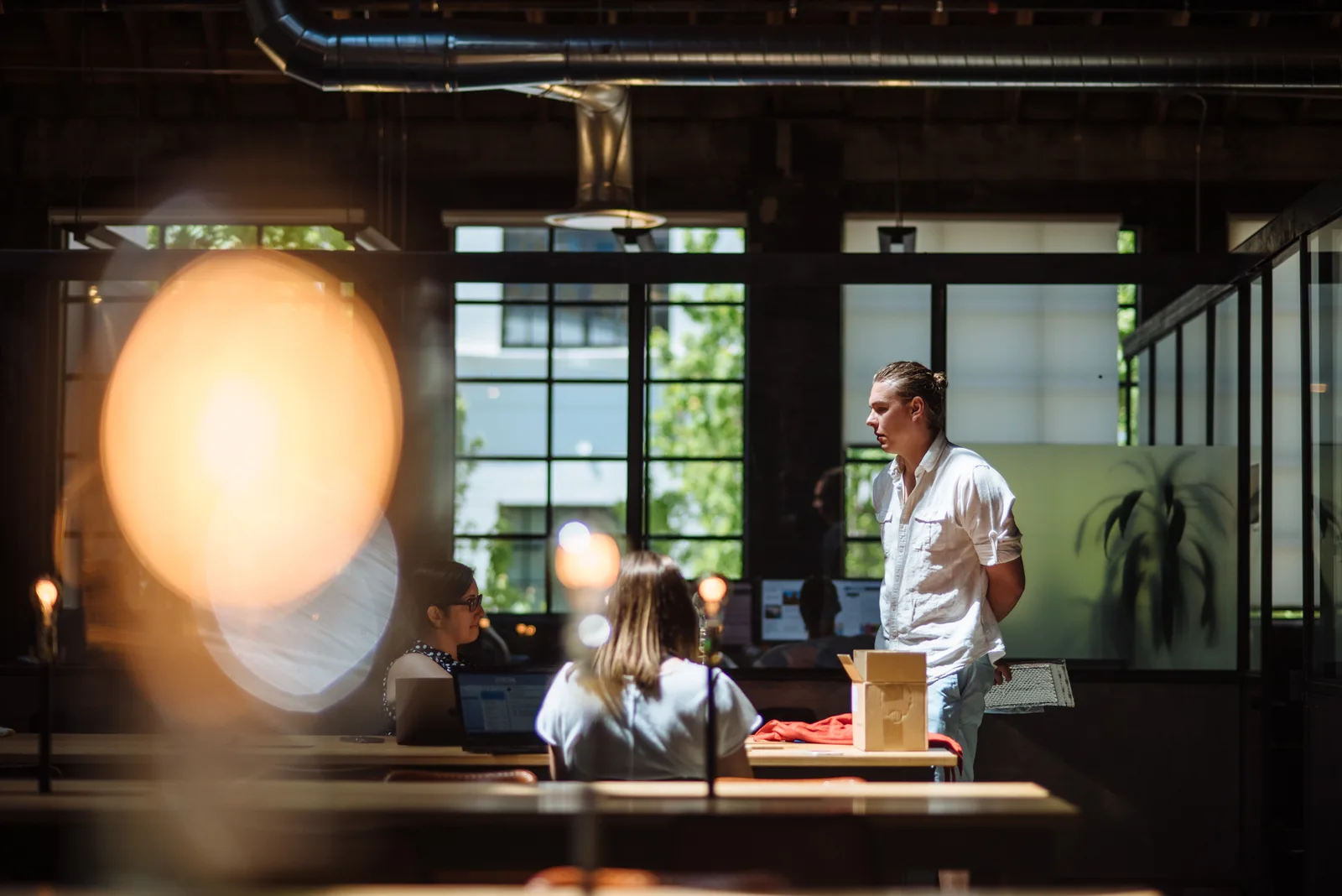 Shared tables by the windows at CENTRL Pearl District.
