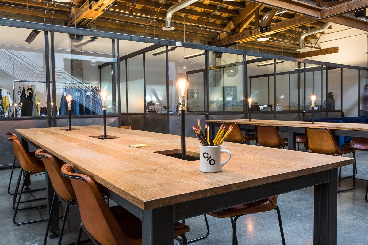 Shared tables under the mezzanine at CENTRL Pearl District.