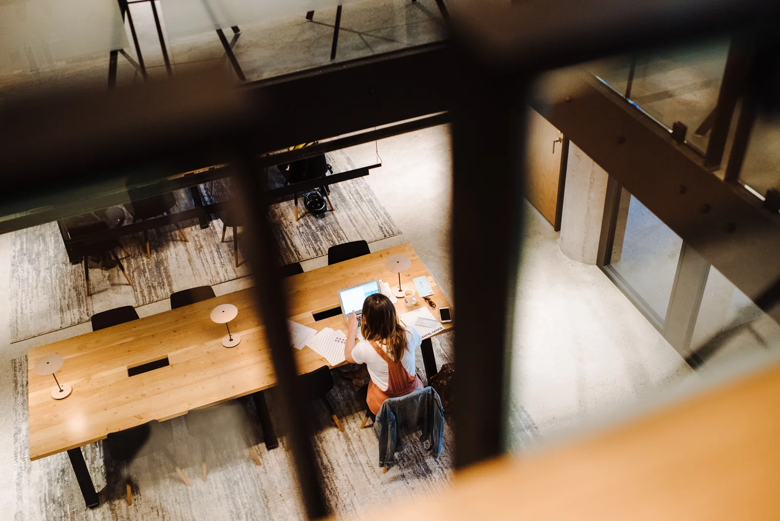 Shared tables seen from the mezzanine at CENTRL West End.