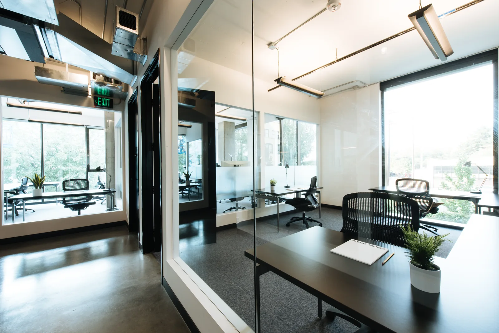 A private office with a desk by the window