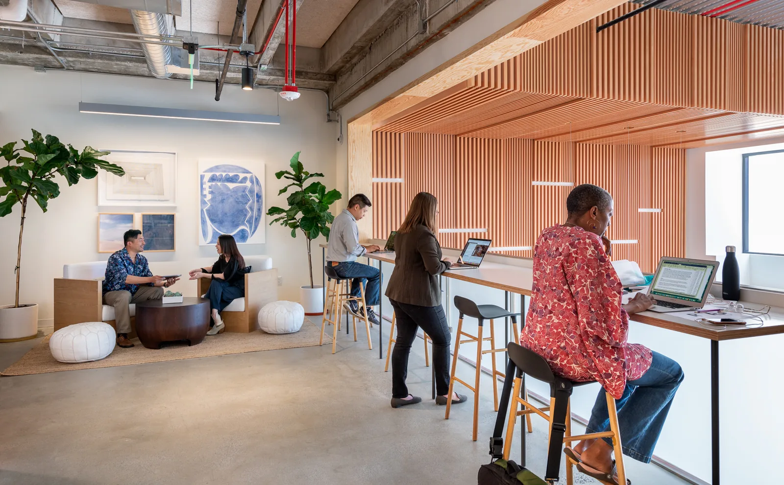 Members working at the counter and lounge in a CENTRL coworking space